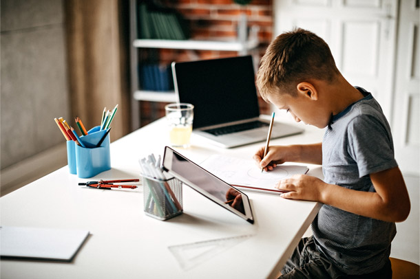 a boy studying at his desk