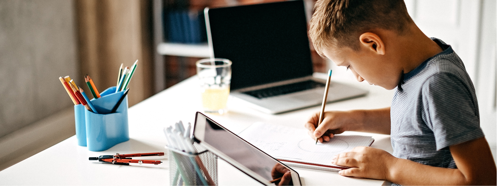a boy studying at his desk