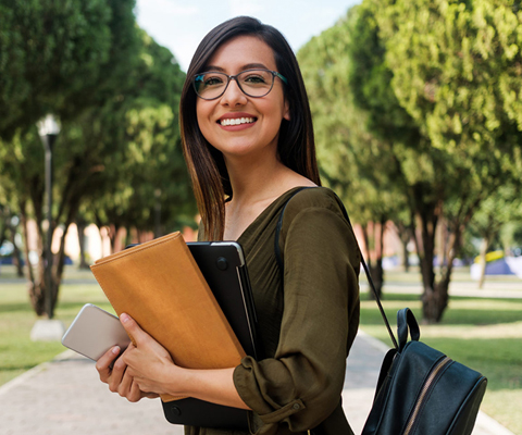teenage student with backpack on campus