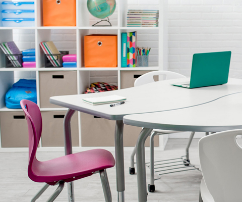 3D rendering of cleanly-designed classroom with laptops and other devices