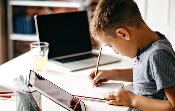 a boy studying at his desk