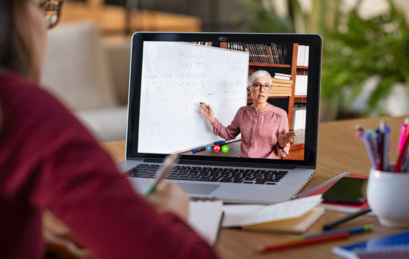 student on a laptop with videoconferencing